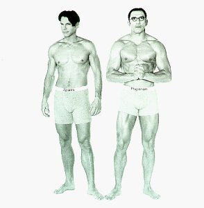 A black and white picture of two well built men in tight shorts standing on a white background. The heads of the men may not be actually related to the bodies. The man the with curly hair is on the left. The man with the small moustache also now has glasses and is on the right.