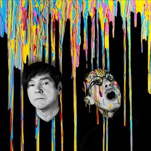 The sleeve of 'A Steady Drip Drip Drip' by Sparks. Two men wearing black on a black background, with multicoloured paint dripping down behind them. The man on the right has paint dripping down his shirt, but the man on the left has got it on his face. It has not yet touched his small moustache.