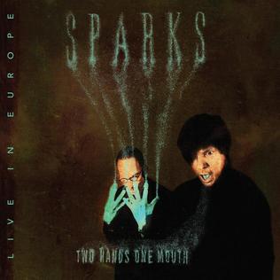 The sleeve of 'Two Hands One Mouth' by Sparks. Two men in the lower half of the image, one with blue hands almost obscuring his small moustache, the other with a blue mouth. The blue from Ron's hands rises like smoke to form the word 'Sparks' above them.